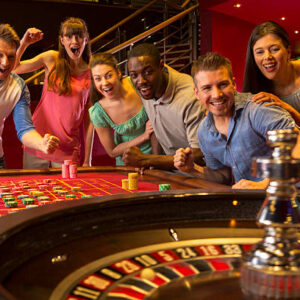 Group Of Friends Playing Roulette In Casino